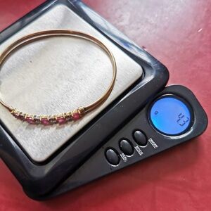 Elegant Gold and Red Bracelet